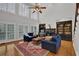 Bright living room with a fireplace, built-in shelving, and a large window at 3305 Millwater Xing, Dacula, GA 30019