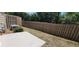 Backyard featuring an AC unit and a wooden fence at 607 Tall Timbers, Woodstock, GA 30188