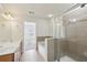 Spacious bathroom with double vanity, separate shower, and soaking tub with neutral tile flooring at 607 Tall Timbers, Woodstock, GA 30188