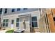 Exterior back view of home featuring a patio and lush landscape at 607 Tall Timbers, Woodstock, GA 30188