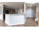 Kitchen with granite countertops, stainless steel appliances, and dark wood cabinets at 607 Tall Timbers, Woodstock, GA 30188
