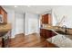 Spacious kitchen featuring granite counters and warm wood cabinetry at 607 Tall Timbers, Woodstock, GA 30188