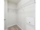 Walk-in closet with wire shelving and neutral carpet, providing ample storage space at 607 Tall Timbers, Woodstock, GA 30188