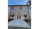 Backyard featuring a concrete patio, gray siding, and double glass doors at 1406 Lucan Nw Ln # Wc221, Lawrenceville, GA 30043
