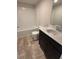 Modern bathroom featuring a large vanity and a tub and shower combination at 1406 Lucan Nw Ln # Wc221, Lawrenceville, GA 30043