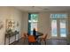 Cozy dining room featuring modern light fixture and access to outdoor patio at 1406 Lucan Nw Ln # Wc221, Lawrenceville, GA 30043