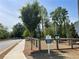 Community dog park with wooden fence, green space, and Mutt Mitt station at 1406 Lucan Nw Ln # Wc221, Lawrenceville, GA 30043
