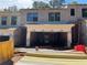 New construction of an exterior view showcasing the early building stages and architectural design in progress at 1406 Lucan Nw Ln # Wc221, Lawrenceville, GA 30043