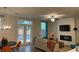 Comfortable living room with a fireplace, ample seating, and access to the backyard at 1406 Lucan Nw Ln # Wc221, Lawrenceville, GA 30043