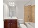 Full bathroom featuring a tub/shower combo, dark vanity, and large mirror at 2513 Friar Tuck Se Ln # 1, Atlanta, GA 30339