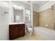The bathroom features tile floors, a shower-tub combo, and a dark wood vanity with a large mirror at 2513 Friar Tuck Se Ln # 1, Atlanta, GA 30339