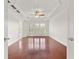 Spacious bedroom with tray ceiling, hardwood floors, and shutters at 2513 Friar Tuck Se Ln # 1, Atlanta, GA 30339
