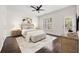 Bright bedroom features a neutral color palette, dark hardwood floors, and a stylish ceiling fan at 2513 Friar Tuck Se Ln # 1, Atlanta, GA 30339
