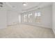 Empty, spacious bedroom featuring carpet, tray ceilings, and natural light at 2513 Friar Tuck Se Ln # 1, Atlanta, GA 30339