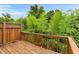 A wood deck overlooks the lush green landscape at 2513 Friar Tuck Se Ln # 1, Atlanta, GA 30339