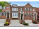 Charming brick townhomes feature well-maintained landscaping and inviting entrances at 2513 Friar Tuck Se Ln # 1, Atlanta, GA 30339