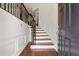 Elegant foyer showcases rich hardwood floors, staircase with iron railings, and classic wainscoting at 2513 Friar Tuck Se Ln # 1, Atlanta, GA 30339