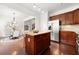 Open kitchen featuring granite countertops, stainless steel appliances, and view of eat-in kitchen with dining table at 2513 Friar Tuck Se Ln # 1, Atlanta, GA 30339