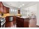 Open kitchen with stainless appliances, island, and breakfast area at 2513 Friar Tuck Se Ln # 1, Atlanta, GA 30339