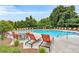 Community pool with lounge seating provides residents with a place to relax at 2513 Friar Tuck Se Ln # 1, Atlanta, GA 30339