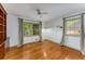 This bedroom has hardwood floors, two windows, and built-in shelving at 2517 Birchwood Ne Dr, Atlanta, GA 30305