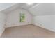 Bonus room with neutral carpet, a window, and a door leading to storage at 2517 Birchwood Ne Dr, Atlanta, GA 30305