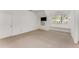 Spacious bonus room featuring a window seat, natural light, and neutral carpet for a comfortable living space at 2517 Birchwood Ne Dr, Atlanta, GA 30305
