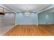 Elegant dining room with a chandelier, hardwood floors, and classic blue wallpaper at 2517 Birchwood Ne Dr, Atlanta, GA 30305