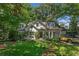 Charming home with a manicured lawn and inviting curb appeal and vintage yellow car at 2517 Birchwood Ne Dr, Atlanta, GA 30305