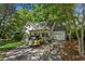 Inviting home with an attached garage and a vintage yellow car in the driveway at 2517 Birchwood Ne Dr, Atlanta, GA 30305