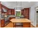 Kitchen with wooden cabinets, stainless steel appliances, granite countertops, and kitchen island with butcher block top at 2517 Birchwood Ne Dr, Atlanta, GA 30305