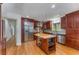 Spacious kitchen with stainless steel appliances, wooden cabinets, kitchen island and granite countertops at 2517 Birchwood Ne Dr, Atlanta, GA 30305