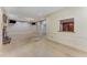 Spacious living room with fireplace, tile flooring, large windows, access to kitchen, and paneled walls at 2517 Birchwood Ne Dr, Atlanta, GA 30305