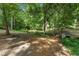 Serene park view featuring a small stone bridge, benches, and a creek meandering through the landscape at 2517 Birchwood Ne Dr, Atlanta, GA 30305