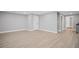 Basement with grey walls, white trim, and access to other rooms in the house at 2535 Hampton Trl, Cumming, GA 30041