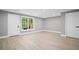 Spacious finished basement with natural light and modern flooring at 2535 Hampton Trl, Cumming, GA 30041