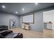 Finished basement with a projector screen and a mini bar perfect for entertaining at 2535 Hampton Trl, Cumming, GA 30041