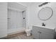 Modern bathroom featuring a shower, toilet, vanity, and a round mirror at 2535 Hampton Trl, Cumming, GA 30041
