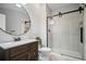 Modern bathroom featuring a glass shower, barn door, and a large vanity with elegant fixtures at 2535 Hampton Trl, Cumming, GA 30041