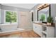 This bathroom features a modern soaking tub, a glass shower, and wood flooring, for a spa-like retreat at 2535 Hampton Trl, Cumming, GA 30041