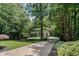 Secluded home on a wooded lot with long driveway and mature trees offers privacy and tranquility at 2535 Hampton Trl, Cumming, GA 30041