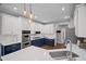 Bright kitchen with granite countertops, white cabinets, modern appliances, and stainless steel sink at 2535 Hampton Trl, Cumming, GA 30041
