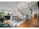 Open living space features a staircase and a seamless flow into the modern kitchen at 2535 Hampton Trl, Cumming, GA 30041