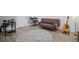 Living room featuring a rug, couch, keyboard, guitar, and an electronic drum set at 2535 Hampton Trl, Cumming, GA 30041