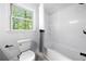 Clean bathroom with shower/tub combo and white and black shower curtain at 3078 Milford Chase Sw, Marietta, GA 30008
