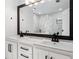 Elegant bathroom features double sinks, modern fixtures, and a large framed mirror at 3078 Milford Chase Sw, Marietta, GA 30008