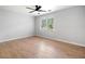 Bright bedroom with hardwood floors, natural light and a ceiling fan at 3078 Milford Chase Sw, Marietta, GA 30008