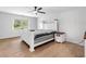 Bright bedroom features a ceiling fan, natural light, and hardwood floors at 3078 Milford Chase Sw, Marietta, GA 30008
