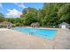 Large community swimming pool with separate diving area, lifeguard station, and lounging spots at 3078 Milford Chase Sw, Marietta, GA 30008