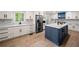 Modern kitchen with stainless steel appliances, a center island with bar seating, and bright countertops at 3078 Milford Chase Sw, Marietta, GA 30008